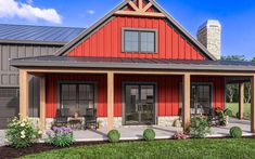 a red barn style house with a porch and covered patio area in front of it