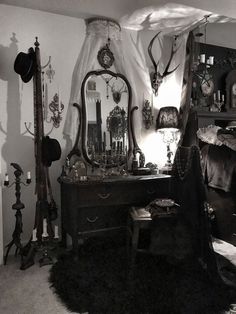 an old fashioned bedroom with antlers on the wall and other items in it's corner