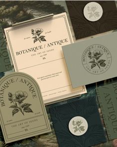 several different types of business cards and envelopes with flowers on them, all in various colors