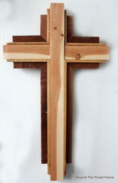 a wooden cross hanging on the wall