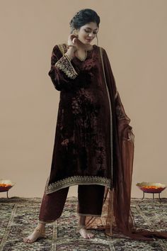 Cola brown velvet  kurta with bell sleeves, hand embroidery in zardozi, aari, and cut dana work. Paired with satin silk pants with swirl pattern, embroidered border and dupatta.
Component: 3
Pattern: Embroidered
Type Of Work: Zardozi, Aari and Cut Dana Work
Neckline: Cut work Round
Sleeve Type: Bell Sleeves
Fabric: Velvet
Color: Brown
Other Details: 
Side slits on kurta
Embroidered dupatta
Closure:
Pants: Side zip
Occasion: Sangeet,Haldi and Mehendi - Aza Fashions Plain Velvet Suit Design, Velvet Suit Designs Pakistani, Brown Velvet Suit, Velvet Suit Design, Velvet Kurta, Pakistani Women, Wedding Outfits For Women, Velvet Dress Designs, Kurta Set For Women