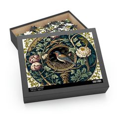 a box with a bird and flowers on the inside is open to show it's contents