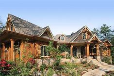 a large house with lots of windows and landscaping