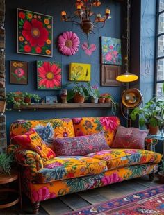 a living room filled with lots of colorful furniture and paintings on the wall next to a window