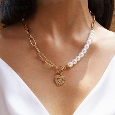 This simple Perla Cayos necklace is truly unique and elegant. A slim charm with pearl and gold chain design that adds an edge to your gorgeous aesthetic look. Layer it, or wear it alone, either way it’s a win. Length: 19.3in / 49.2cm Pendant length: 1.4in / 3.5cm #pearlnecklaceaesthetic #fallnecklaces #necklaceforher #necklacesaestheticgold #simplegoldnecklace Quotes Spring, Necklace Chain Types, Tiered Necklace, Heart Choker, Gold Jewelry Necklace, Fashion Quotes, Pearl Pendant Necklace, Pearl Choker