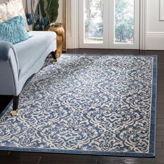 a blue and white rug in a living room