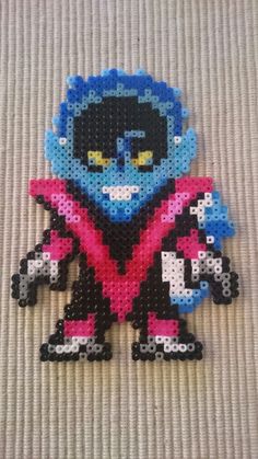 an image of a beaded stitched character