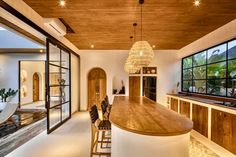 a kitchen with an island counter and bar stools