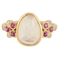 This ring has been meticulously crafted from 14-karat yellow gold. It is set in 2.26 carats of moonstone, .32 carats pink sapphire and .06 carats of sparkling diamonds. Also available in Aquamarine. The ring is a size 7 and may be resized to larger or smaller upon request. FOLLOW MEGHNA JEWELS storefront to view the latest collection & exclusive pieces. Meghna Jewels is proudly rated as a Top Seller on 1stDibs with 5 star customer reviews. All items manufactured by us are handmade and can be cus Kelly Rutherford, Moonstone Rings, Contemporary Ring, Blake Lively, Moonstone Ring, Top Seller, Sparkle Diamonds, Pink Sapphire, Cocktail Rings