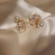 ✦ Indulge in the romance of our elegant stud earrings adorned with a delicate flower pearl design, perfect for adding a touch of grace to your wedding ensemble or elevating your bridesmaid look. Crafted with meticulous detail, these earrings encapsulate the essence of romance, making them an ideal choice for those special occasions. The timeless appeal of the flower pearl design adds a subtle and sophisticated charm, making these earrings a versatile accessory for various elegant events. Whether Red Opal, Front Back Earrings, Ear Jacket Earring, Basic Jewelry, Ear Jacket, Jewelry Style, Red Style, Elegant Flowers, Earring Type