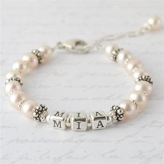 a bracelet with the word mia on it