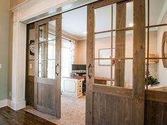 an open door leading to a kitchen and living room