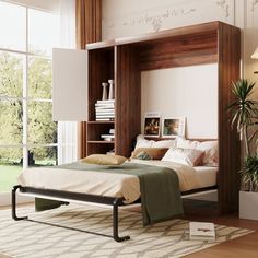 a bed sitting in the middle of a bedroom next to a book shelf filled with books