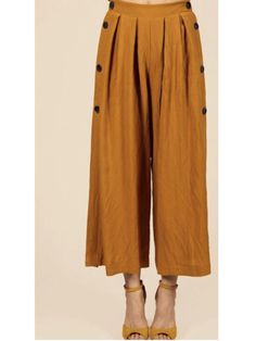 It's your favoirte pair of casual pants! Solid wide leg pants with side slits, and side buttons 95% Rayon, 5% Nylon Lining, 100% polyester Color: Burnt orange Model is wearing a small Measurements for Small: Waist: 13 inches flat, has extra stretch with elastic waist band, Length: 37 inches flat, rise: 14 inches flat For Measurements for Medium: Waist: 14 inches, has extra stretch with elastic waist band, Length: 38 inches flat, rise: 14 inches flat Shop the look! Pants With Side Slits, Pants Large, Loose Pants, Small Waist, Waist Band, Burnt Orange, Elegant Style, Leg Pants, Wide Leg Pants