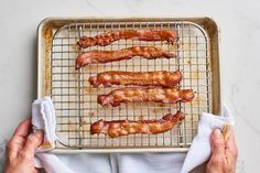 bacon strips on a baking sheet ready to be cooked in the oven or baked in an oven