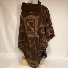 Lauren Ralph Lauren Cape Poncho Made In Italy With Southwestern Aztec Design. Cape Is Wool Blend 75% Lambswool 25% Nylon. Warm And Comfortable Cape Poncho Is One Size Fits All Condition Is Very Nice Vintage Pre Owned Please See All Photos Native American Shawl, Rustic Brown Outdoor Outerwear, One Size Brown Cape Outerwear, Cozy Brown Poncho For Outdoor, Brown Long Sleeve Poncho For Outdoor, Brown Bohemian Cape Outerwear, Bohemian Brown Cape Outerwear, Southwestern Brown Outerwear For Fall, Southwestern Style Brown Outerwear For Fall