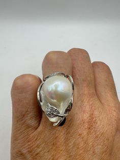 Vintage Biwa white pearl Ring rhodium 925 Sterling Silver Cocktail Statement Eternity wedding band  Huge Boho style  Size adjustable. 5-10 All rings are shipped free in the US in a nice gift box.   Check out our over a THOUSAND great reviews Engraving is $4 per letter and is not always perfect depending on the piece. It can take a few days if the jeweler is busy. This is payable to Paypal Judithsltd@gmail.com Luxury High Luster Pearl Ring In Silver, Luxury Exquisite Silver Pearl Ring, Vintage Adjustable Silver Pearl Ring, Luxury Vintage Sterling Silver Pearl Ring, Hallmarked Sterling Silver Pearl Ring, White Pearl Ring, Biwa Pearls, Silver Cocktail, Eternity Wedding Band