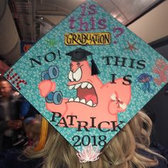 a blue graduation cap with an image of a cartoon character on it that says, no this is patrick