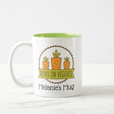 a white and green coffee mug with some carrots on it's side that says twins on veggies melane's mug