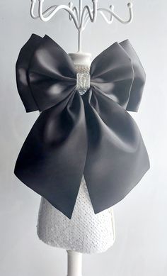 Black and silver detachable satin ribbon bow Bow Measures 16 cm and 24 cm down with tails, please check measurements to make sure size suits your needs.  Bow is attached to small brooch pin for easy attaching Luxury Detachable Bow For Gift, Chic Decorative Bow For Black Tie Events, Satin Decorative Bow For Black Tie Events, Elegant Black Ribbon Bow Tie For Evening, Black Ribbon Bow For Evening, Elegant Black Satin Bow, Detachable Bow Satin Bow Tie For Party, Satin Bow Tie With Ribbon For Party, Party Satin Bow Tie With Detachable Bow