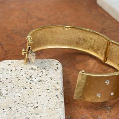 18KT yellow gold wide, hammered, matte-finished, cuff bangle bracelet with gypsy-set genuine diamonds across the front of the cuff. Width: 22mm Weight: 61.30 grams 750/ 18KT Purity Stamped 18K 1.5mm Thickness .66 carat diamond VS/GH (11) stones Secure snap, with safety latch Substantial piece! Luxury Hammered Wide Band Jewelry, Luxury Hammered Bangle Cuff Bracelet, Cuff Bangle Bracelet, White Gold Bracelet, Rose Gold Pendant, White Gold Necklaces, White Gold Earrings, Rose Gold Bracelet, Yellow Gold Bracelet