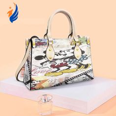 Introducing the exquisite Mickey and Minnie Mouse Disney Fashion Lady Handbag! This enchanting accessory is a must-have for all Disney Disney Kiss, Hawaiian Shirt Women, Mickey And Minnie Mouse, Disney Fashion, Fashion Lady, Mickey And Minnie, Timeless Accessories, Disney Style, Everyday Items