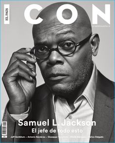 a black and white photo of a man wearing glasses on the cover of a magazine