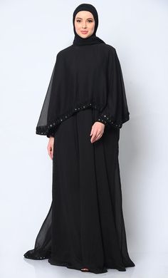 Step into the realm of elegance and sophistication with our stunning 3-piece ensemble, meticulously crafted to redefine your style with grace and beauty. The focal point of this ensemble is the Abaya, featuring a delicately embroidered border that adds a touch of regal charm to its classic silhouette. This Abaya,  Acco Elegant Cape Kaftan For Eid, Elegant Eid Abaya With Cape, Elegant Embroidered Black Abaya, Elegant Long Sleeve Wedding Niqab, Elegant Embellished Cape Kaftan, Elegant Black Floor-length Dress Set, Elegant Black Floor-length Set, Elegant Festive Abaya With Dabka Details, Elegant Long Sleeve Abaya With Dabka