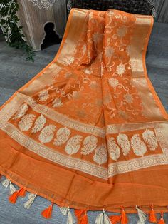 Soft Banarsi dupatta on Chanderi silk by cotton, finished with beautiful tassels. Bohemian Cotton Silk Traditional Wear With Dupatta, Bohemian Traditional Wear With Dupatta In Cotton Silk, Festive Chanderi Traditional Wear With Tassels, Festive Traditional Chanderi Wear With Tassels, Orange Cotton Silk Dupatta For Wedding, Semi-stitched Orange Cotton Silk Dupatta, Festive Orange Slub Silk Dupatta, Bohemian Cotton Sheer Dupatta, Bohemian Cotton Silk Sheer Dupatta