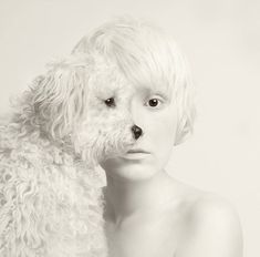 a woman with white hair and a dog's face