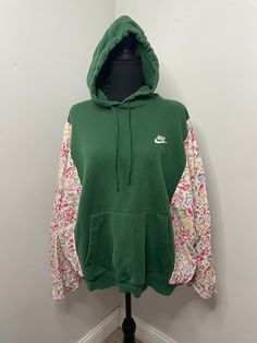 green floral hoodie rework using upcycled/thrifted materials SLEEVES ARE 3/4 LENGTH, THEY ARE NOT FULL LENGTH SLEEVES! The floral material is also very lightweight, making it perfect for spring. Please note before purchasing :) Pit to pit: 31" Length: 23" Fits S-L (the body will fit up to a 2XL but the sleeves only fit up to a large WASHING INSTRUCTIONS: for color preservation, please wash in cold water. Hang to dry! Vintage Long Sleeve Hoodie For Spring, Vintage Hooded Hoodie For Spring, Green Patchwork Sweatshirt For Streetwear, Vintage Green Hooded Hoodie, Vintage Green Long Sleeve Hoodie, Green Patchwork Hoodie For Streetwear, Spring Patchwork Hoodie Sweatshirt, Green Sweatshirt For Spring Streetwear, Green Spring Sweatshirt For Streetwear