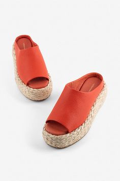 Leather upper Memory foam insole Rubber sole Raffia heel Slip-on styling Imported | Hightide Sandals by Intentionally Blank in Red, Women's, Size: 9, Leather/Rubber at Anthropologie Summer Leather Espadrilles With Textured Footbed, Orange Leather Wedge Sandals For Beach, Modern Slip-on Sandals With Woven Sole, Modern Closed Toe Mules For Beach, Modern Open Toe Heels With Woven Sole, Modern Wedge Sandals For Beach, Modern Flat Heel Wedge Sandals For Beach, Orange Closed Toe Mules For Summer, Orange Slip-on Heels For Beach