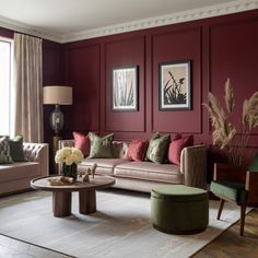 a living room with red walls and furniture