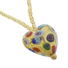 Every woman loves to own unique handcrafted jewelry. This Murano necklace in rich gold and millefiori palette is every woman's dream, rich and beautiful like Venice itself. The authentic Murano necklace features an exquisite 24K gold-layered heart pendant suspended from an elegant gold-lined beaded necklace accented with gorgeous 24K gold-lined and millefiori Murano glass beads. Enjoy this unique Murano Necklace and the aura of Venetian romance and elegance that it projects. Measurements: The he Gold Necklaces With Heart Beads For Jewelry Making, Gold Heart Beads Pendant Necklace, Gold Pendant Necklace With Heart Beads, Elegant Multicolor Heart Beads Necklace, Murano Glass Round Necklace For Gifts, Murano Glass Round Necklaces For Gifts, Gold Murano Glass Jewelry For Gifts, Gold Murano Glass Jewelry As Gift, Gold Murano Glass Jewelry Gift