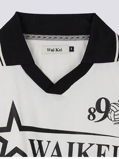 a white and black shirt with the number 98 on it's left chest, in front of a gray background