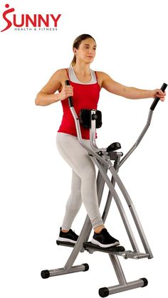 a woman is using an exercise machine