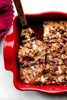 a red casserole dish filled with cranberry bread