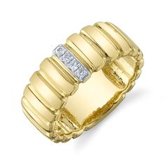 a yellow gold ring with diamonds