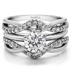 a white gold engagement ring set with an oval center stone and twisted shants on the band