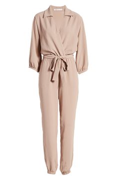 The jumpsuit trend is, well, hopping, and this option, styled with an easy tied waist and elastic cuffs, is a winning way to wear the look. Style Name:Fraiche By J Tie Waist Long Sleeve Jumpsuit. Style Number: 6177668. Chic Beige Jumpsuits And Rompers For Work, Spring Long Sleeve Jumpsuits And Rompers With Tie Waist, Spring Loungewear Belted Jumpsuits And Rompers, Relaxed Fit Beige Jumpsuit For Work, Spring Relaxed Fit Jumpsuit With Tie Waist, Chic Jumpsuits With Tie Waist And Relaxed Fit, Chic Relaxed Fit Jumpsuits And Rompers With Tie Waist, Beige Jumpsuits And Rompers For Fall Workwear, Chic Beige Jumpsuits And Rompers With Relaxed Fit