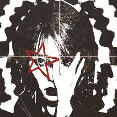 a woman with her hand on her face and red star in the middle of her forehead