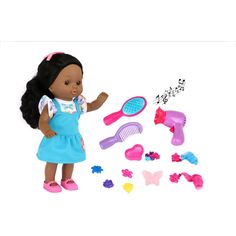 the doll is playing with her hairbrush and combs in front of some toys