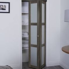 a tall cabinet in the corner of a room