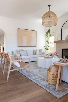 the living room is clean and ready for guests to come home with their family members