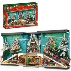 a lego christmas village set is shown with its box open and it's contents