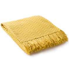 a yellow throw blanket with fringes on the bottom and one piece of it folded up