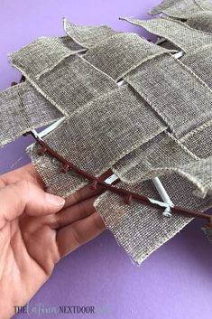 someone is stitching together fabric to make a sailboat