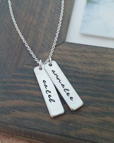 "« Mommy Necklace // Personalized Necklace with Kids Names // Hand Stamped Jewelry // Personalized Name Necklace // Custom Name Bar » If you are looking for the perfect gift for any mom or grandma, this is it! A unique way to carry your loved ones close to your heart! ♥ Each name is carefully hand stamped on a 1.2\" rectangle tag in our gorgeous script font. The rectangles are strung from an 18 inch oval link chain. The rectangles can be personalized with up to 10 characters on each. Please choo Cute Personalized Everyday Jewelry, Cute Everyday Personalized Jewelry, Simple Hand Stamped Necklace As Gift, Silver Rectangular Custom Name Jewelry, Hand Stamped Rectangular Necklaces For Mother's Day, Hand Stamped Rectangular Jewelry For Mother's Day, Rectangular Hand Stamped Jewelry For Mother's Day, Personalized Rectangular Pendant Jewelry For Birthday, Handmade Necklace For Everyday And Mother's Day