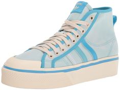 PRICES MAY VARY. Women's classic platform high top shoes made in part with Parley Ocean Plastic FLEXIBLE UPPER: Soft textile upper is stretchy and comfortable PLATFORM MIDSOLE: Platform midsole adds a little extra height and style RUBBER OUTSOLE: The rubber outsole provides outstanding grip and a sleek, low-profile look PARLEY OCEAN PLASTIC: This shoe's upper is made with yarn containing at least 50% recycled polyester and 50% Parley Ocean Plastic. The yarn contains plastic waste from remote isl Adidas Ultra Boost Women, Ultra Boost Women, Adidas Platform, Adidas Nmd R1 White, Adidas Nizza Platform, Adidas White Sneakers, Adidas Sneakers Women, Adidas Originals Women, Cute Nikes