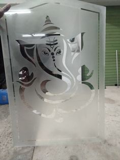 a glass block with an image of the face of ganesh